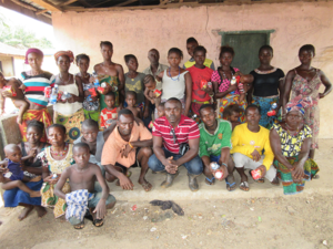 Ernest Aruna with a community dialogue group in Mabarrow, Port Loko district, Sierra Leone.