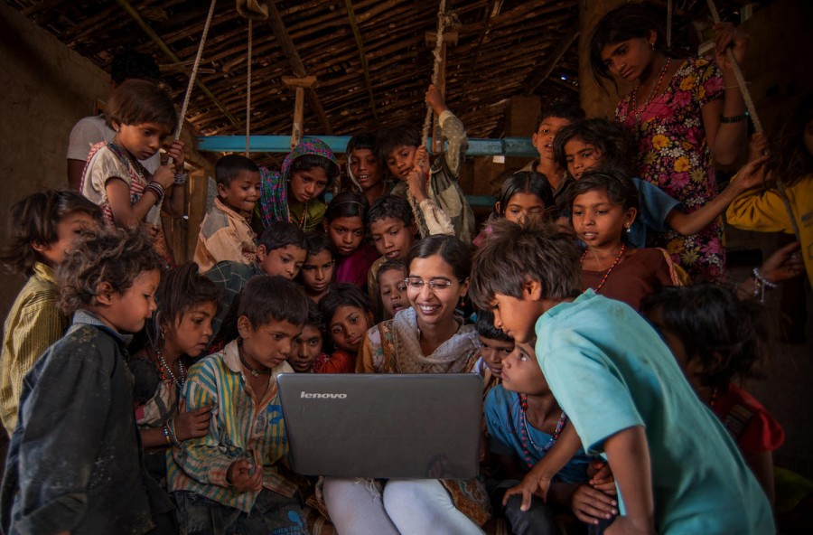 An NGO volunteer teaches basic computer information