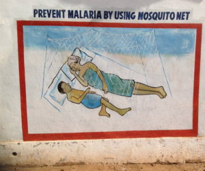 A malaria prevention message on the wall outside Redemption Hospital in Monrovia, Liberia. © 2016 Sean G. Smith / Critical-Care Professionals International, Courtesy of Photoshare