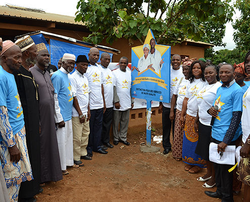 Event held on September 1, 2016 in Dixinn, Guinea; the billboard shows the gold star logo, signifying a high quality, service delivery health center.