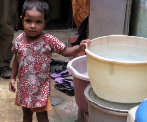 Credit: A young girl in Kolkata, India, stands by her family's cholera-contaminated water supply. 